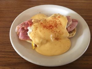 Breakfast sandwich featuring bolognaise sauce, ham, and English muffins at Village Kitchen in Angola, IN